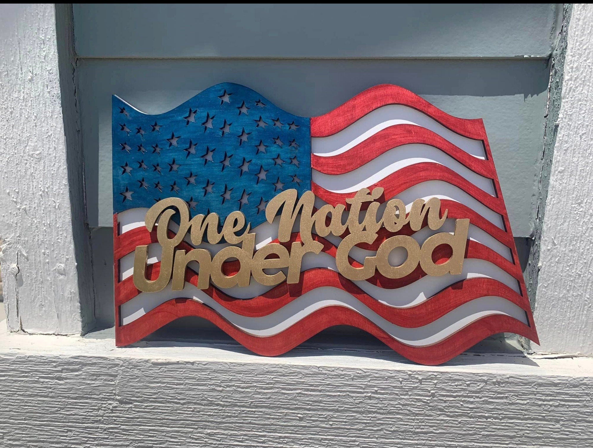 9 Variations of our Laser Engraved Patriotic Door Hanger, Door Sign for the 4th of July featuring Red White and Blue Holiday Signage